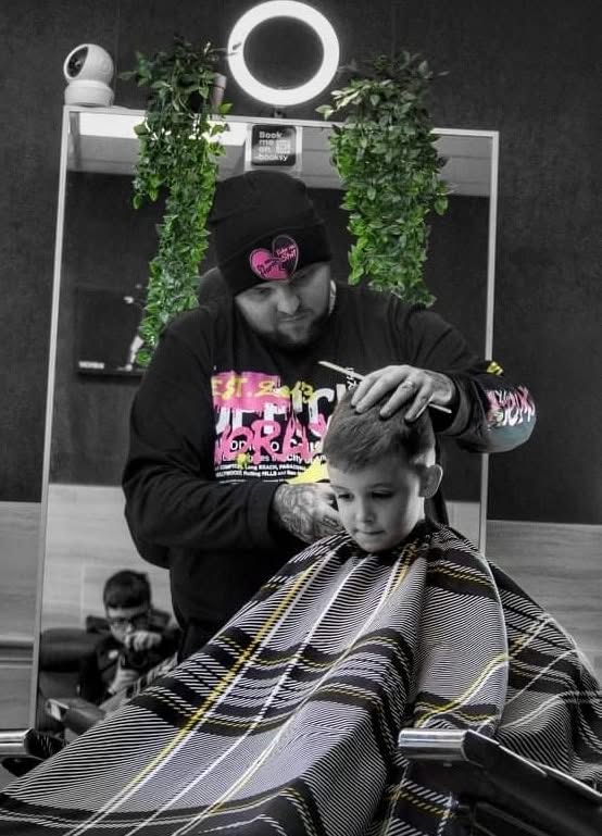 Barber giving a child a haircut