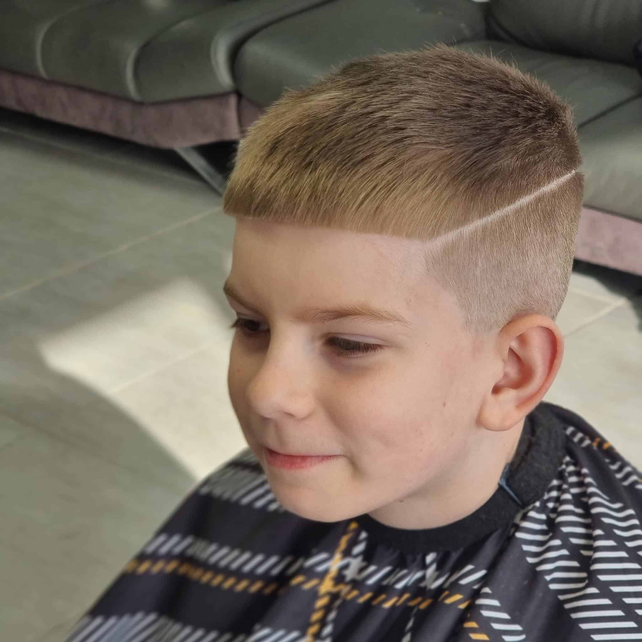 Boy with a skin fade and hard part