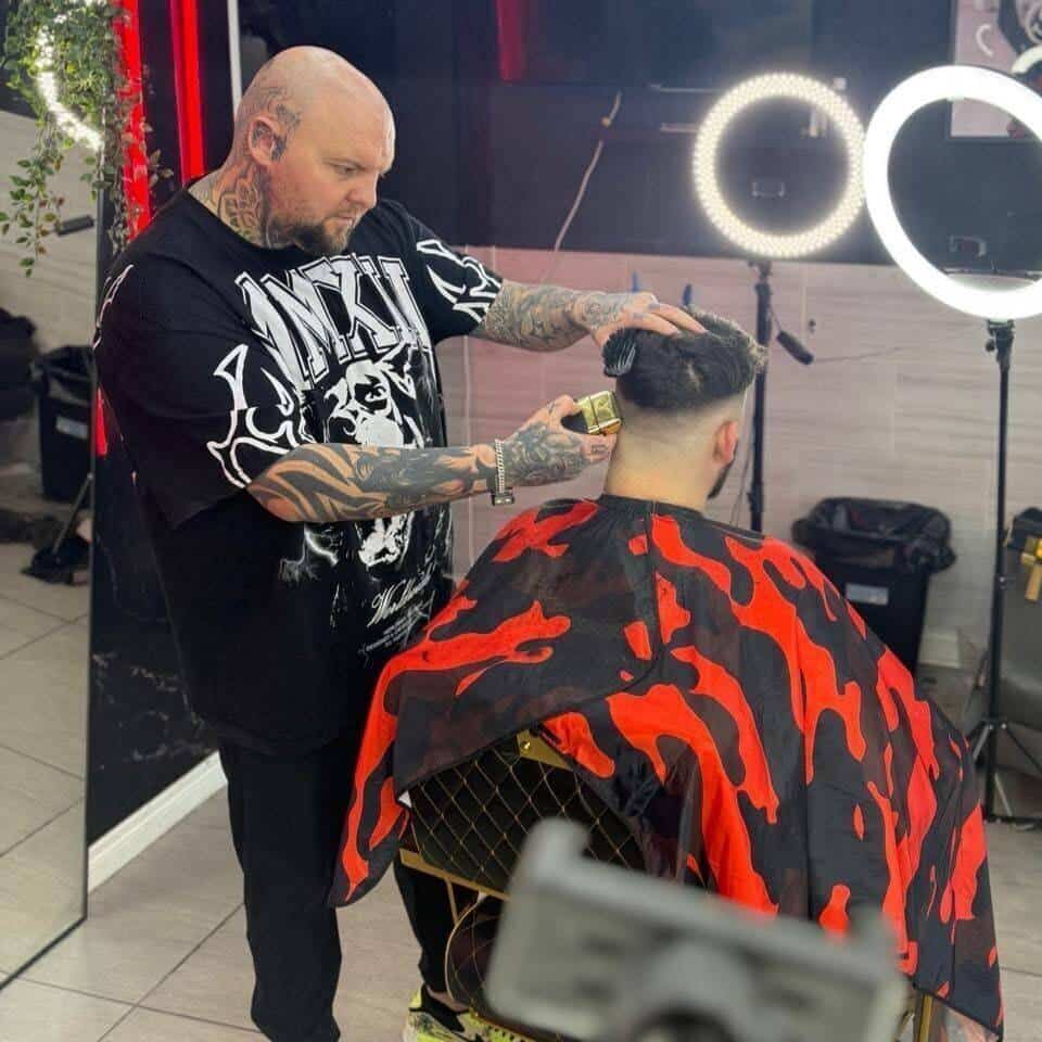 Barber giving a client a precision haircut